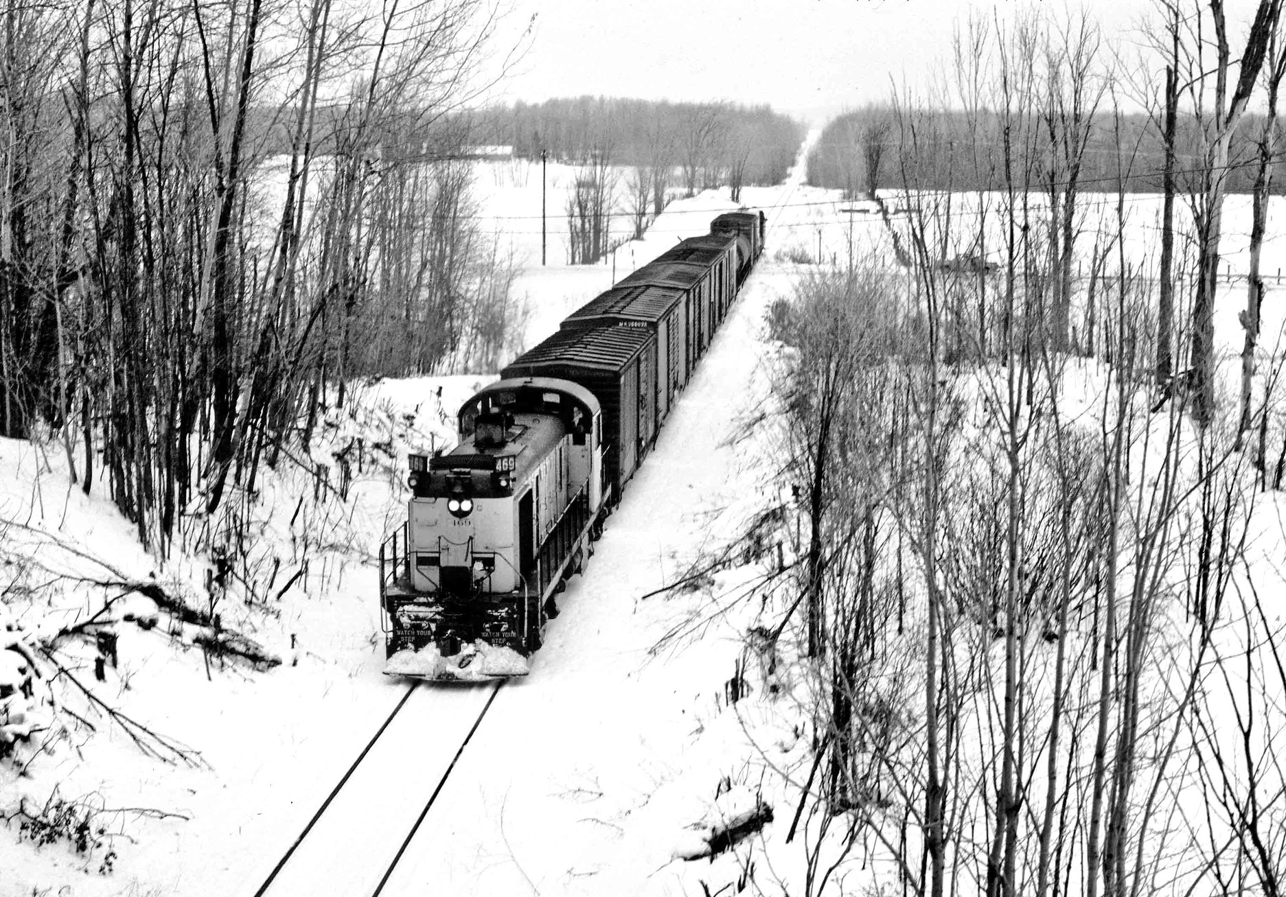 D&M 469 leada a freight train near Vanderbilt MI